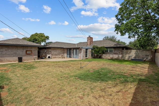 2900 E 21st St, Odessa, TX 79761 - rear view of property featuring a chimney and a patio area