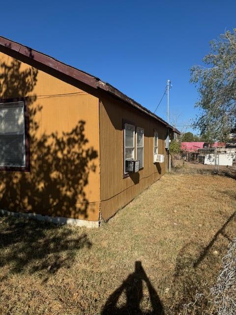 view of side of property featuring cooling unit