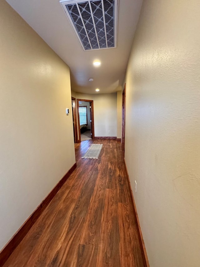 hallway featuring dark hardwood / wood-style floors