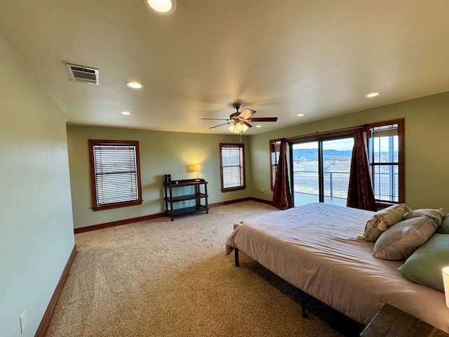 carpeted bedroom with ceiling fan