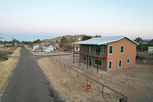 rear view of property featuring a mountain view