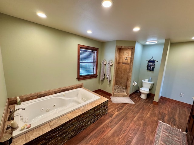 bathroom featuring independent shower and bath, wood-type flooring, and toilet