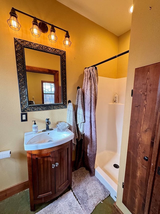 bathroom with vanity and a shower with shower curtain