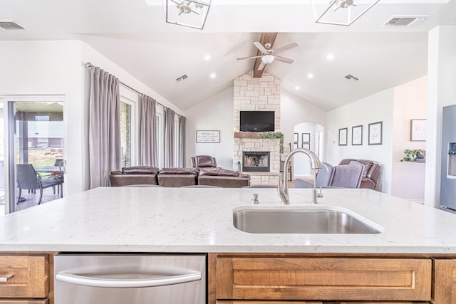 479 County Rd 306, Seminole, TX 79360 - kitchen featuring stainless steel dishwasher, open floor plan, a sink, and visible vents
