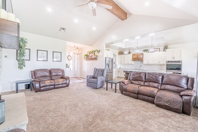 479 County Rd 306, Seminole, TX 79360 - living room featuring visible vents, light carpet, beamed ceiling, recessed lighting, and ceiling fan with notable chandelier