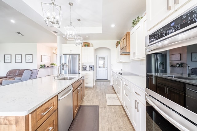 479 County Rd 306, Seminole, TX 79360 - kitchen featuring a sink, appliances with stainless steel finishes, visible vents, and a chandelier