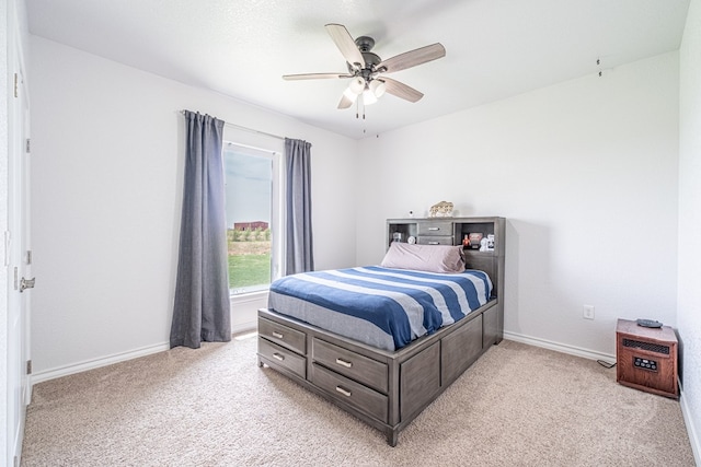 479 County Rd 306, Seminole, TX 79360 - bedroom featuring baseboards, light colored carpet, and ceiling fan