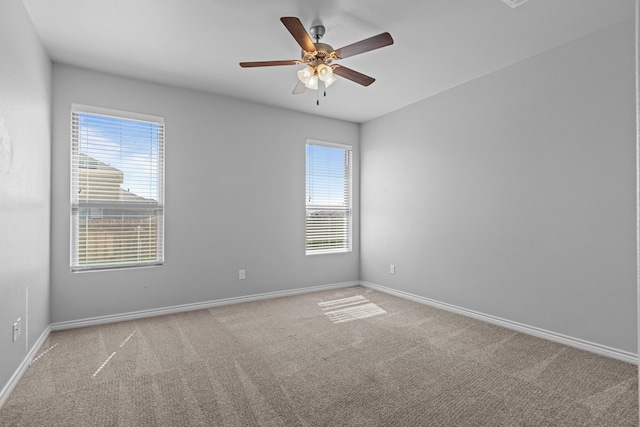 2208 Boise Dr, Odessa, TX 79762 - carpeted empty room featuring plenty of natural light and a ceiling fan
