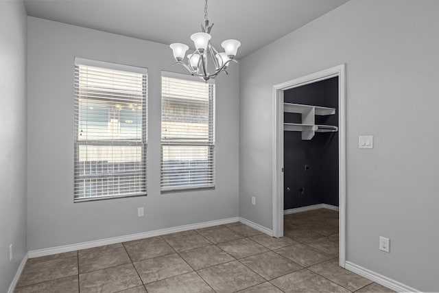 2208 Boise Dr, Odessa, TX 79762 - spare room featuring a chandelier and tile patterned flooring