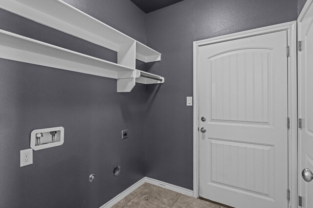 2208 Boise Dr, Odessa, TX 79762 - laundry room featuring washer hookup, electric dryer hookup, and tile patterned flooring