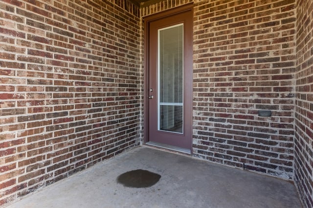 2208 Boise Dr, Odessa, TX 79762 - property entrance featuring brick siding and a patio area
