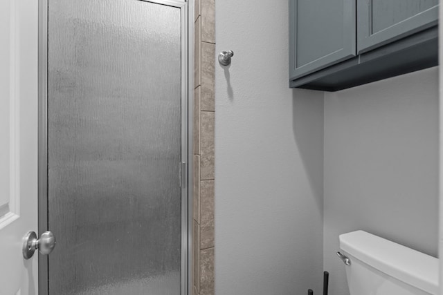 2208 Boise Dr, Odessa, TX 79762 - bathroom featuring toilet and an enclosed shower