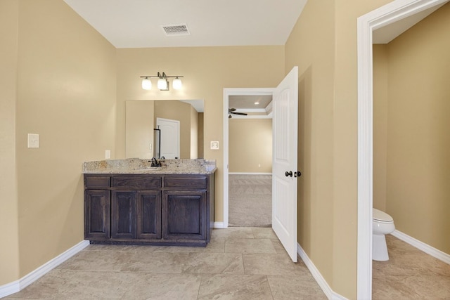 14 Da Vinci Ct, Odessa, TX 79765 - bathroom featuring toilet, vanity, and baseboards