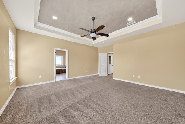 14 Da Vinci Ct, Odessa, TX 79765 - unfurnished room featuring a tray ceiling, ceiling fan, baseboards, carpet, and crown molding