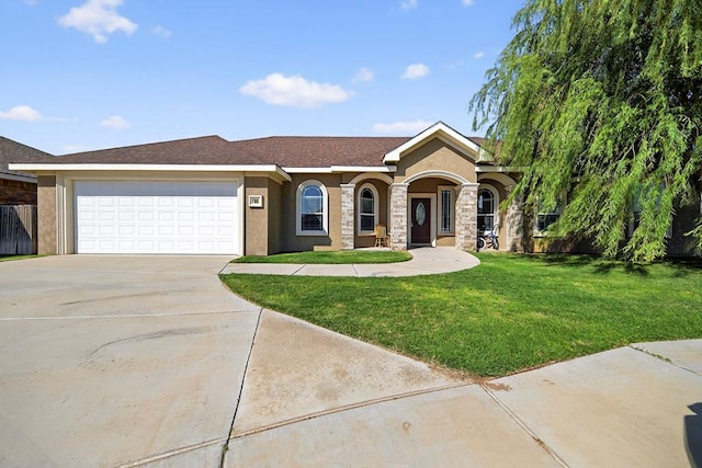 14 Da Vinci Ct, Odessa, TX 79765 - view of front of property with concrete driveway, a front yard, stucco siding, and an attached garage