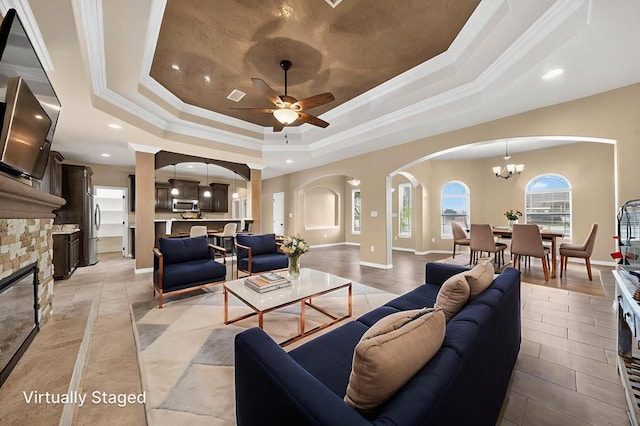 14 Da Vinci Ct, Odessa, TX 79765 - living room with a raised ceiling, arched walkways, crown molding, recessed lighting, and a ceiling fan