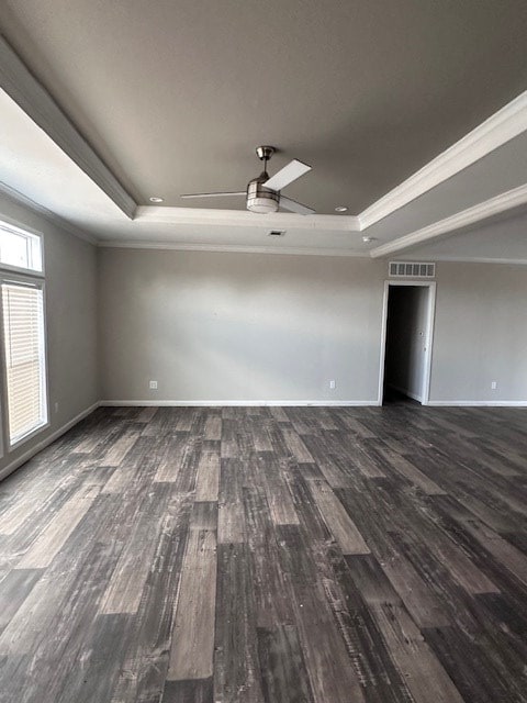 610 Magnolia, Kermit, TX 79745 - unfurnished room featuring a tray ceiling, wood finished floors, ornamental molding, and ceiling fan