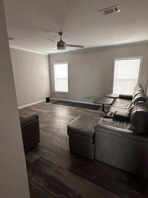 610 Magnolia, Kermit, TX 79745 - living room with crown molding, ceiling fan, and wood finished floors