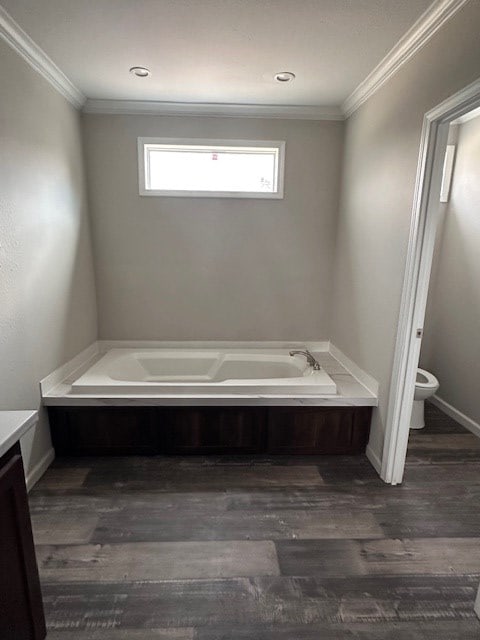 610 Magnolia, Kermit, TX 79745 - bathroom with a bath, vanity, crown molding, and wood finished floors