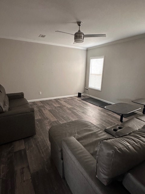 610 Magnolia, Kermit, TX 79745 - living room featuring ornamental molding, dark wood-type flooring, and a ceiling fan