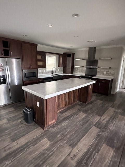 610 Magnolia, Kermit, TX 79745 - kitchen with stainless steel appliances, open shelves, a kitchen island, wall chimney exhaust hood, and dark wood-style floors