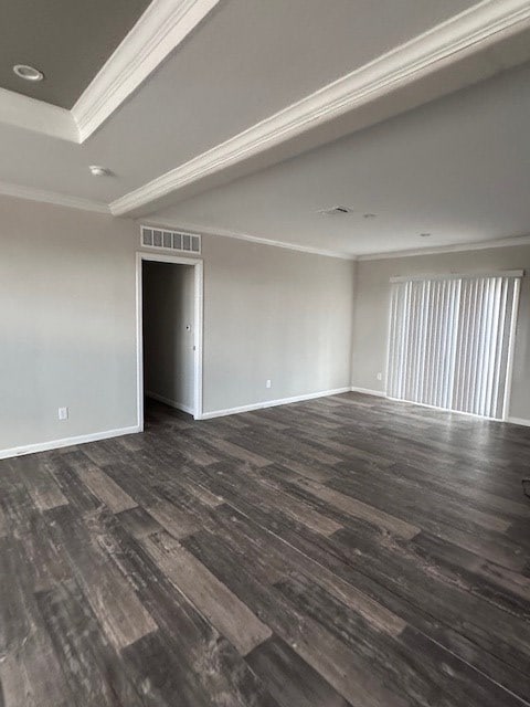 610 Magnolia, Kermit, TX 79745 - spare room with ornamental molding, dark wood-type flooring, and recessed lighting