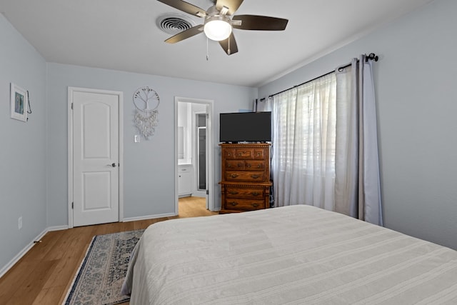 3700 Fairmont Dr, Odessa, TX 79762 - bedroom featuring light wood-style floors, connected bathroom, and a ceiling fan