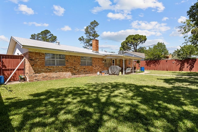 3700 Fairmont Dr, Odessa, TX 79762 - rear view of property with brick siding, a chimney, and a patio