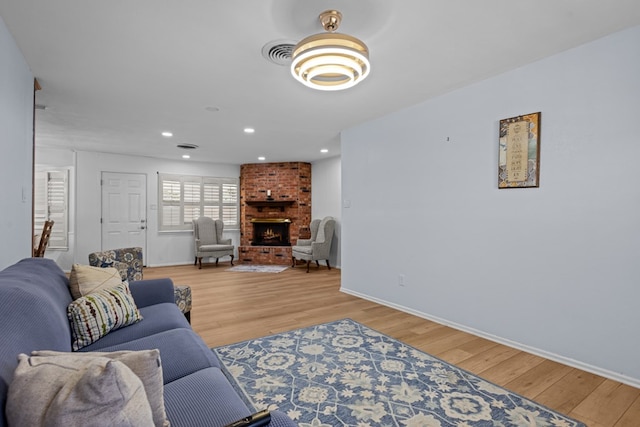 3700 Fairmont Dr, Odessa, TX 79762 - living area with light wood-type flooring, a fireplace, and recessed lighting
