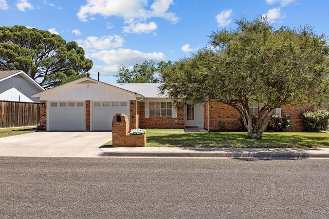 3700 Fairmont Dr, Odessa, TX 79762 - ranch-style home featuring an attached garage, driveway, and brick siding