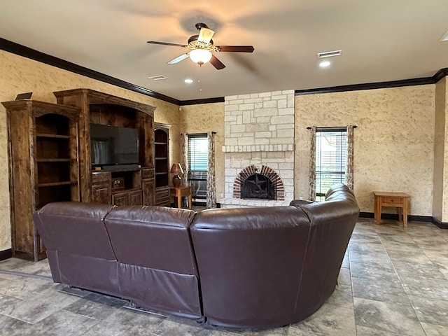 7802 Sienna Dr, Odessa, TX 79765 - living room featuring ornamental molding, a ceiling fan, and a fireplace