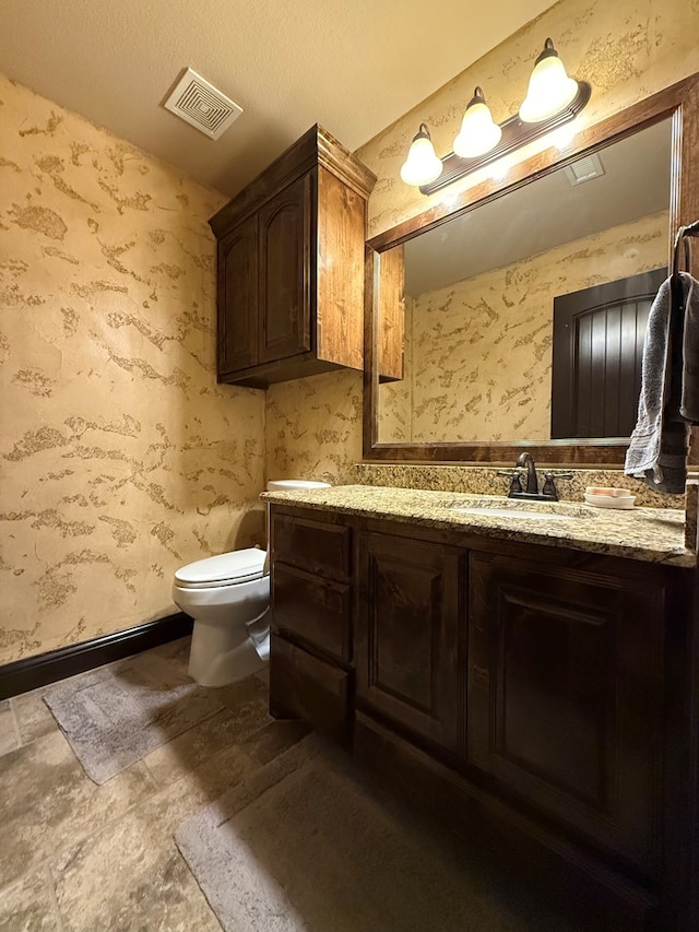 7802 Sienna Dr, Odessa, TX 79765 - bathroom with vanity and wallpapered walls