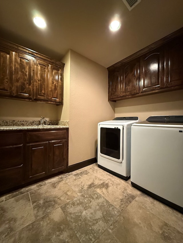7802 Sienna Dr, Odessa, TX 79765 - washroom with washer and clothes dryer, cabinet space, and recessed lighting