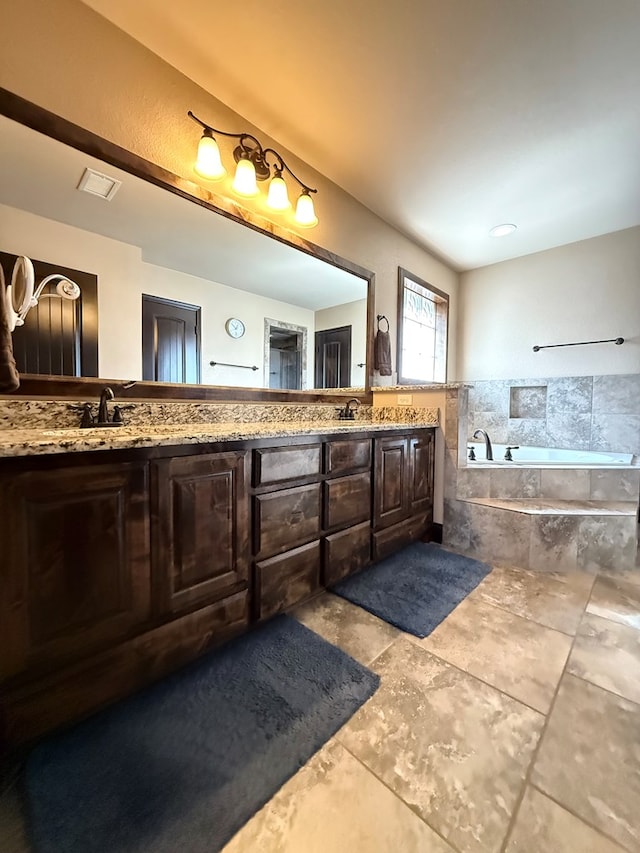 7802 Sienna Dr, Odessa, TX 79765 - bathroom with double vanity and a bath