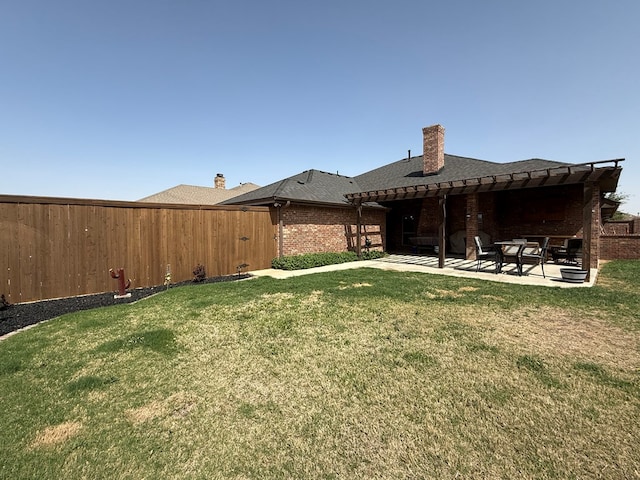 7802 Sienna Dr, Odessa, TX 79765 - rear view of property featuring a pergola, a fenced backyard, brick siding, a patio, and a chimney