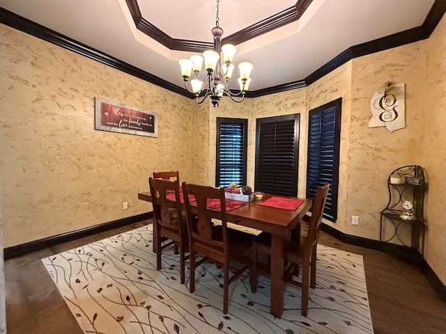 7802 Sienna Dr, Odessa, TX 79765 - dining room with a chandelier, crown molding, wood finished floors, and a tray ceiling