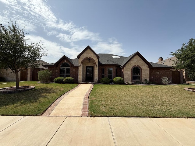 7802 Sienna Dr, Odessa, TX 79765 - view of front of home featuring stone siding and brick siding