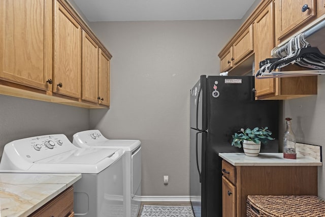 3960 Rabb St, Odessa, TX 79762 - laundry area featuring washing machine and clothes dryer and cabinet space