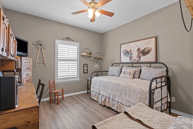 3960 Rabb St, Odessa, TX 79762 - bedroom featuring wood finished floors and a ceiling fan