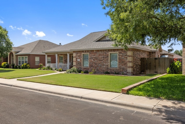 3960 Rabb St, Odessa, TX 79762 - ranch-style home featuring brick siding, roof with shingles, and a porch