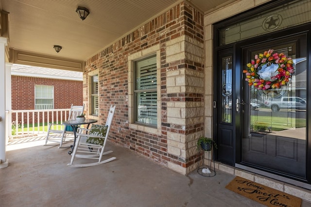3960 Rabb St, Odessa, TX 79762 - property entrance featuring a porch and brick siding