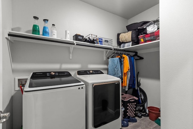 laundry area with washing machine and clothes dryer