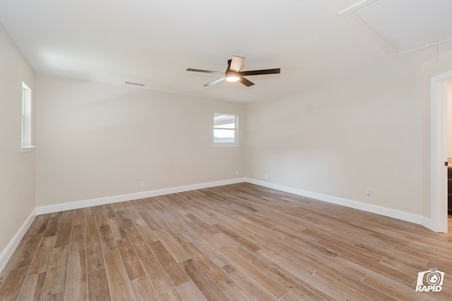 3201 Reo Dr, Midland, TX 79705 - unfurnished room with attic access, light wood finished floors, ceiling fan, and baseboards