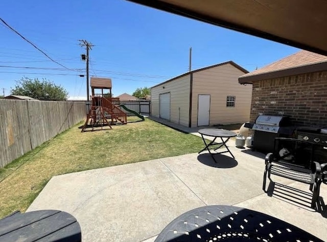 view of patio featuring a grill and a playground