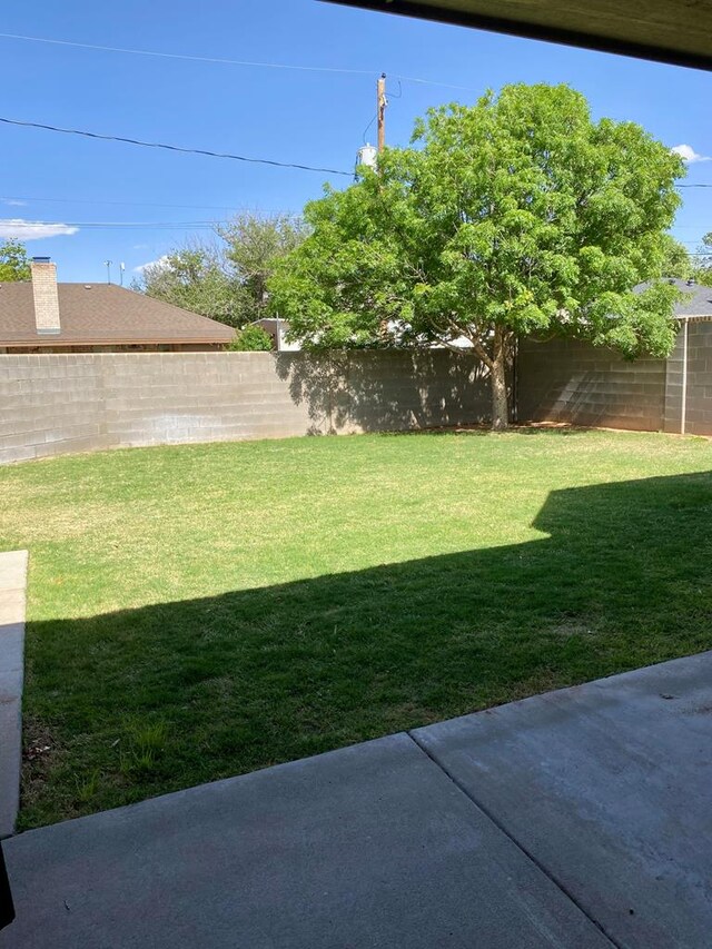1508 Cedar Ln, Andrews, TX 79714 - view of yard featuring a fenced backyard