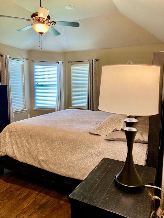 bedroom featuring dark wood-style flooring and ceiling fan
