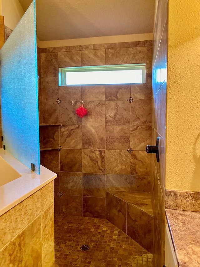 bathroom with walk in shower and a wealth of natural light