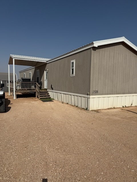 view of side of home with a deck