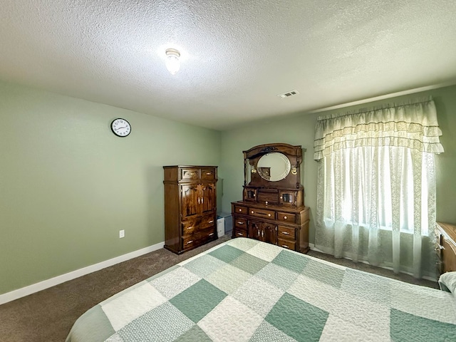 305 County Rd 306, Seminole, TX 79360 - carpeted bedroom with a textured ceiling and baseboards