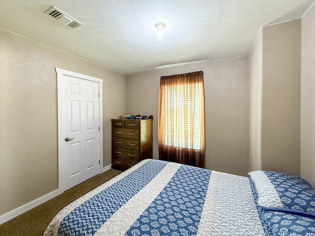305 County Rd 306, Seminole, TX 79360 - bedroom with carpet flooring and a textured ceiling